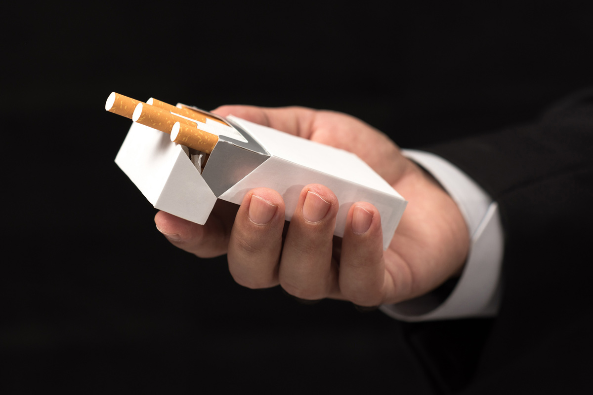 Cigarettes are implicated in the development of gum disease.